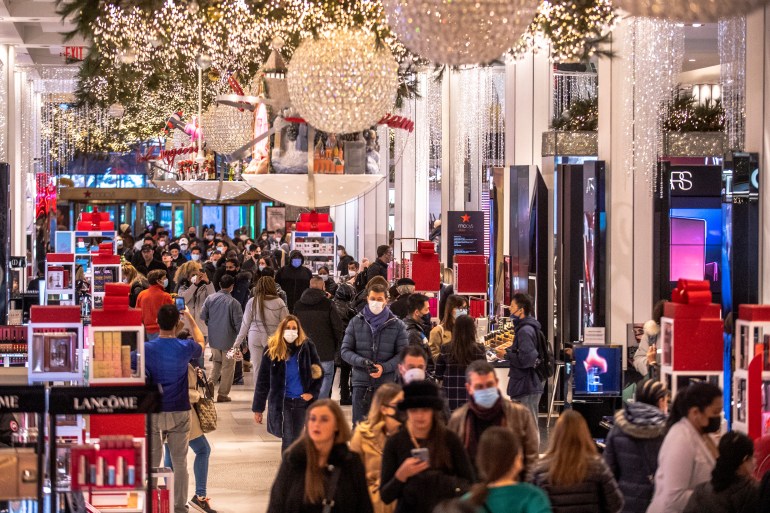 Black Friday shoppers walk through Macy's in November, 2021