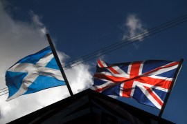 A saltire flag and Union Jack flutter in the wind on March 9, 2017 in Glasgow, Scotland [Jeff J Mitchell/Getty Images]