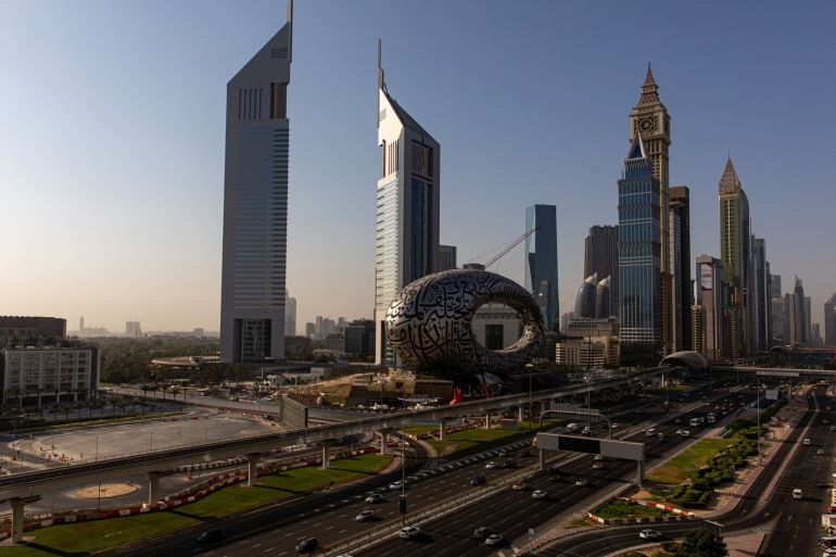 Commuters drive along Sheikh Zayed Road past commercial and residential properties in Dubai, United Arab Emirates, October 13, 2020