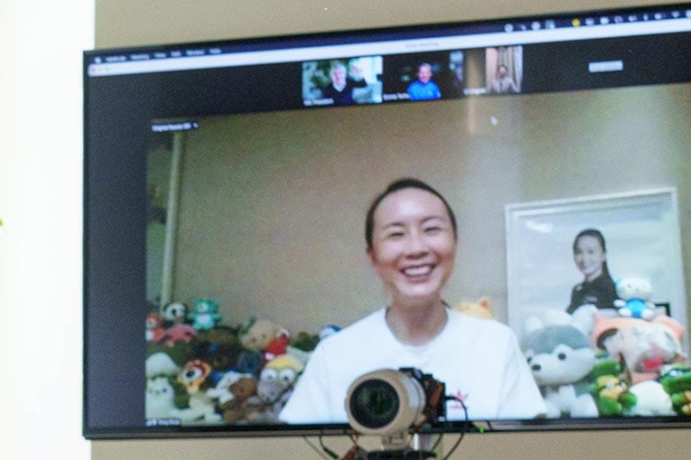 A handout photo made available by the International Olympic Committee (IOC) website shows a video call with Chinese tennis star Peng Shuai on 21 November 2021.