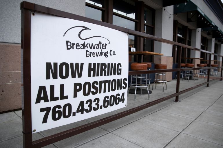 A restaurant advertising jobs looks to attract workers in Oceanside, California, U.S.