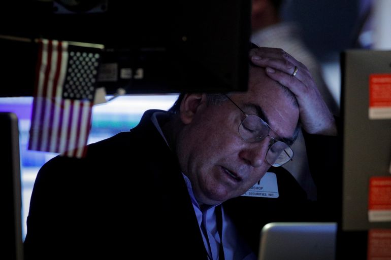 A trader reacts on the floor of the New York Stock Exchange (NYSE) in New York City, U.S.