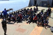 Asylum seekers sit aboard a Libyan coastguard vessel arriving at the capital Tripoli&#39;s naval base on February 28, 2021 [File: Mahmud Turkia/AFP]