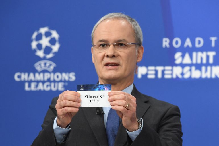 UEFA Deputy General Secretary Giorgio Marchetti holds the name of Villarreal CF during the Champions League round of 16 draw