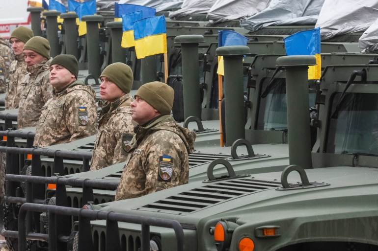 Ukrainian servicemen attend a rehearsal of an official ceremony to hand over tanks and military vehicles to the Ukrainian forces as the country celebrates Army Day in Kyiv on December 6, 2021.