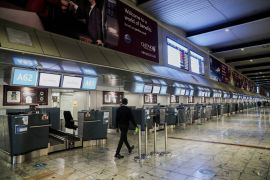 International check-in counters stand empty after several airlines stopped flying out of South Africa because of the spread of the new Omicron coronavirus variant, at OR Tambo International Airport in Johannesburg on November 28, 2021 [Reuters/Sumaya Hisham]