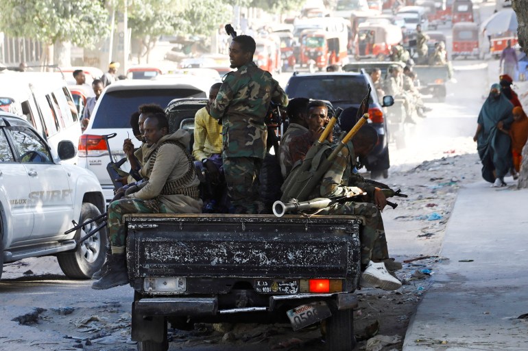 Somali military ride on pick-up trucks in Mogadishu, Somalia