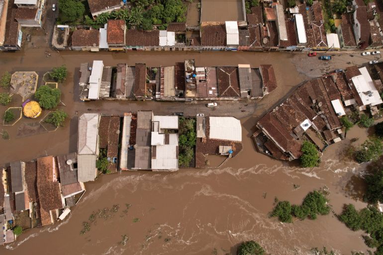 An aerial view shows flooded streets, caused due to heavy rains, in Itajuipe, Bahia state, Brazil December 27, 2021. Picture taken with a drone. REUTERS/Amanda Perobelli