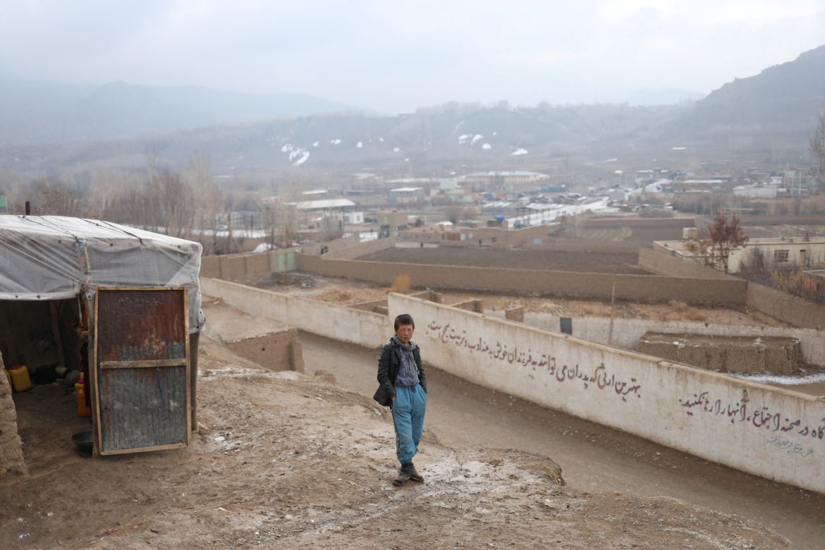 A boy stands on a hill in Bamiyan, Afghanistan