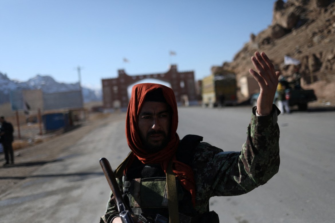A Taliban fighter stands at a checkpoint near Bamiyan, Afghanistan
