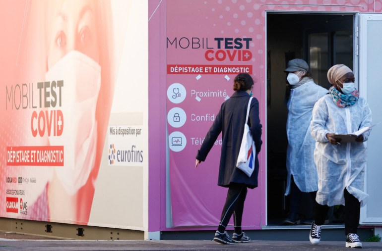 A woman arrives at a mobile coronavirus disease (COVID-19) testing booth in Paris, France