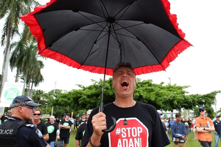 An activist at a rally in Mackay, Queensland in Australia, protesting against the Adani mine