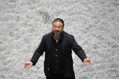 Chinese artist Ai Weiwei poses with some seeds from his art installation &#39;Sunflower Seeds&#39; in London&#39;s Tate gallery on October 11, 2010 [File: AP/Lennart Preiss]