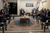 Hassan Al-Adari, head of the political body of the Sadrist bloc and Sadrists delegation meets with Hoshyar Zebari, head of the Kurdish delegation to negotiations on forming the new government after the parliamentary elections in Baghdad on November 5, 2021 [File: AP/Hadi Mizban]