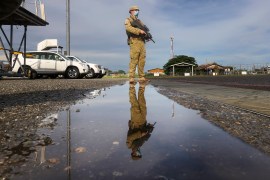 An Australian soldier stands on the tarmac at Honiara Airport in November.
