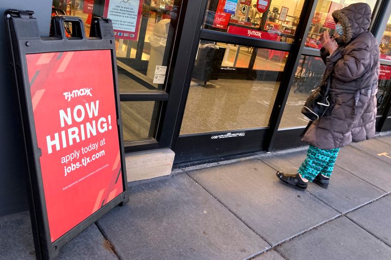 A hiring sign is seen outside of a retail store in Mount Prospect, Ill.