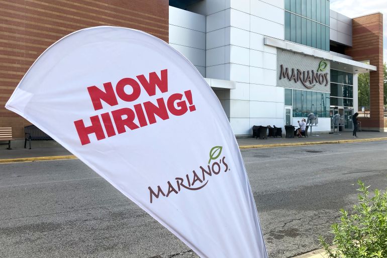 A hiring sign in the parking lot of Mariano's grocery store advertises the availability of jobs, in Chicago, US