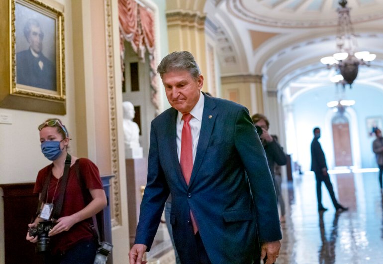 Senator Joe Manchin, a centrist Democrat vital to the fate of President Joe Biden's $ 1.75 trillion spending plan, walks alone to a Democratic caucus lunch at the Capitol 