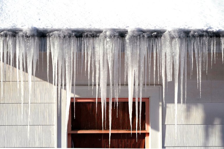 Long icicles hang from a house where nearly a foot of snow fell over the weekend in Bellingham, Washington