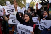 Activists shout slogans during a protest against hate speech in New Delhi, India, Dec.27, 2021. [AP Photo/Manish Swarup]
