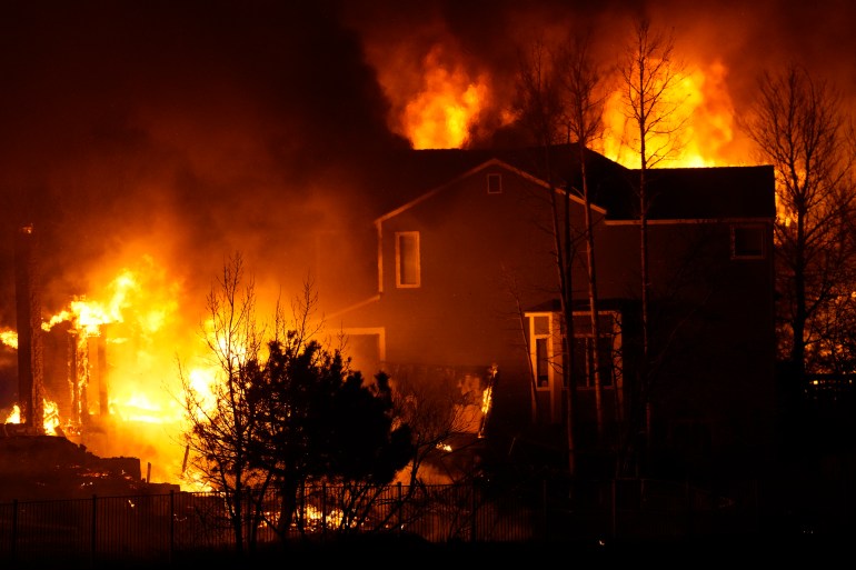 Homes burn as wildfires rip through a development in Superior, Colorado