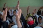 Afghan girls attend a class at a school in Qala-e-Naw in Badghis province, Afghanistan on October, 09, 2021 [Majid Saeedi/Getty Images]