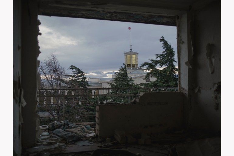 The departure hall of Tbilisi airport from the Soviet period is photographed from a former hotel where refugees from Abkhazia now live