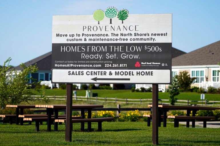 A homes sale sign is shown in front of a new home construction site in Northbrook, Illinois, United States