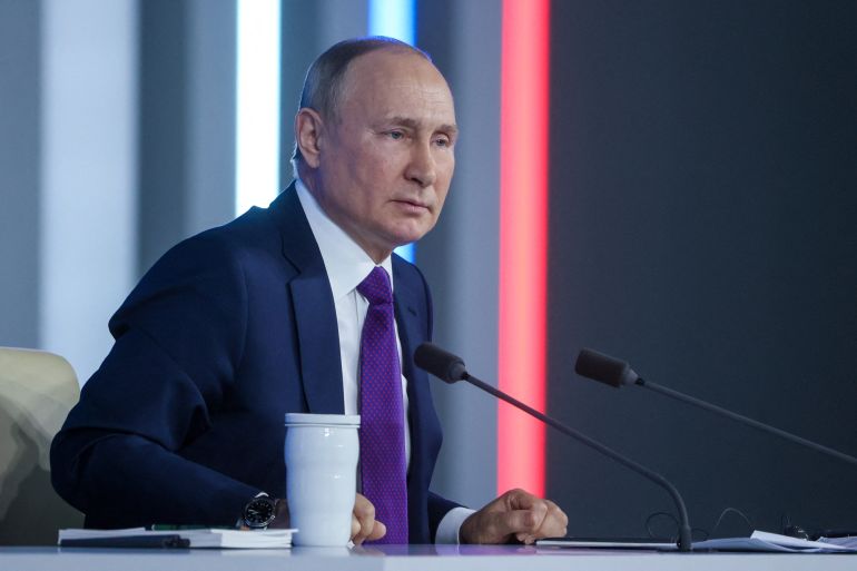 Russian President Vladimir Putin attends his annual end-of-year news conference in Moscow, Russia