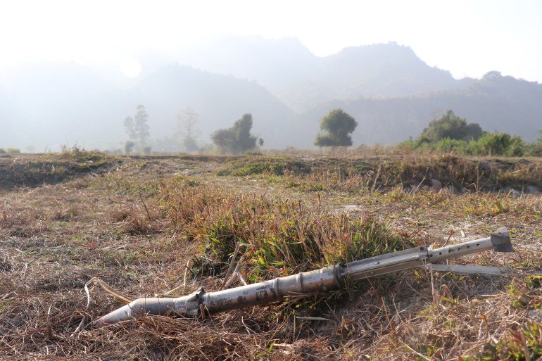 Unexploded ordinance lying in a field of dried brown grass and earth Rathedaung township after fresh fighting in Rakhine state between the Myanmar military and the Arakan Army 