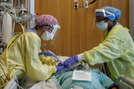 Redeployed nurses Angela Bedard, left, and Andrea Blake tend to a patient suffering from coronavirus disease (COVID-19) at Humber River Hospital's Intensive Care Unit, in Toronto, Ontario, Canada, on April 28, 2021.