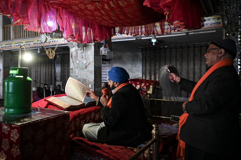 Afghan Sikh priest praying at the Karte Parwan Gurdwara temple in Kabul.