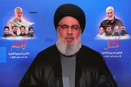 Photo of Hezbollah leader Hasan Nasrallah on a screen during his televised speech