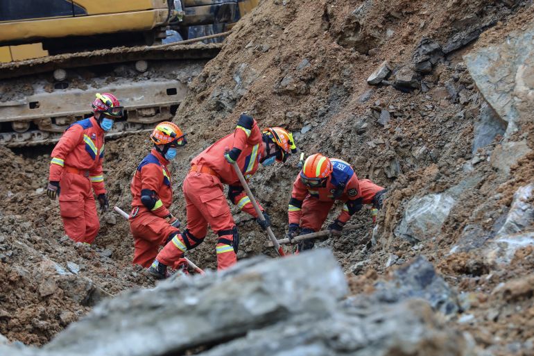 Rescuers work at the scene of a landslide in Bijie, China's southwestern Guizhou province