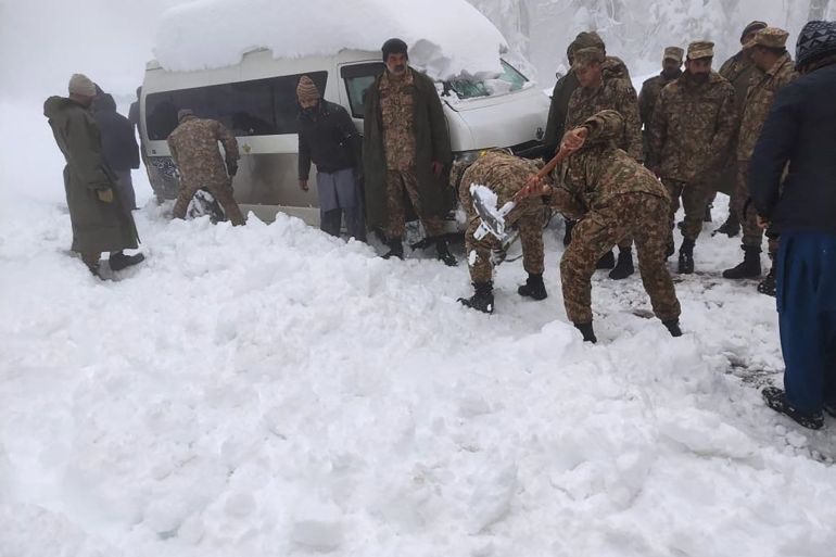Army soldiers clear road covered with snow in Murree, around 70 kilometres northeast of Islamabad.