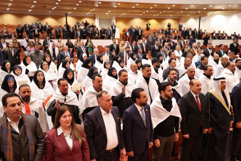 Iraqi lawmakers attending the inaugural session of the parliament in Baghdad