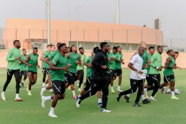 Nigeria's national team players run during a training session in Garoua on January 10, 2022, on the eve of the Africa Cup of Nations (CAN) 2021 football match between Ngeria and Egypt. (Photo by Daniel Beloumou Olomo / AFP)