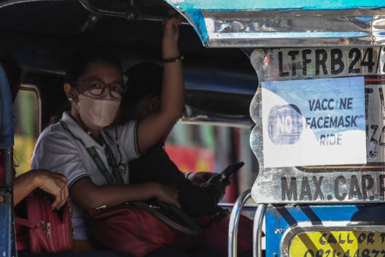 A commuter on jeepney in Manila suburb