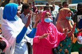 People chant slogans during an anti-coup protest in Khartoum [AFP]
