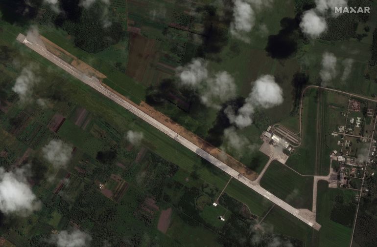 A satellite picture shows the ash-covered runway of Tonga's main airport with runway markings obscured 