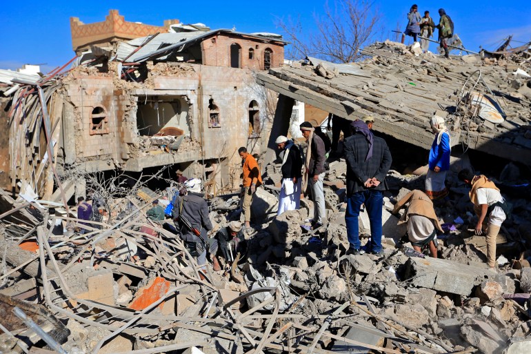 Yemenis inspect the damage following overnight air strikes by the Saudi-led coalition in Sanaa