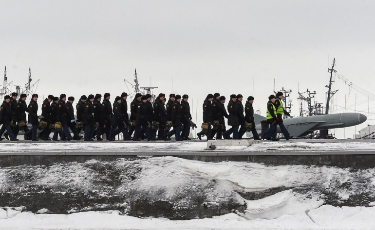 Russia's Navy Cadets Walk Along a Pier
