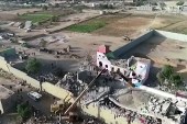 This image grab from a handout video made available by the Ansarullah Media centre shows destruction at a prison in the Houthi rebel stronghold of Saada in northern Yemen after it was hit in an air raid [Ansarullah media center via AFP]