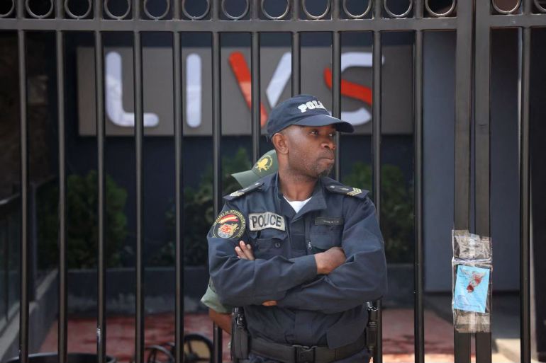 A policeman stands guard at the entrance of the Livs night-club