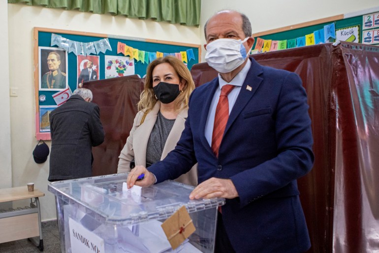 Turkish Cypriot President Ersin Tatar alongside his wife casts his ballot