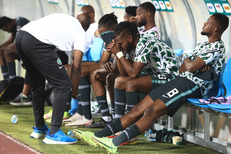 Nigeria's players react after losing the match