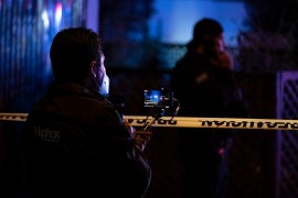 Journalists cover the crime scene where journalist Lourdes Maldonado was murdered in Tijuana's outskirts