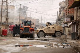 US soldiers accompanied by members of SDF in the neighbourhood of Ghwayran in Syria