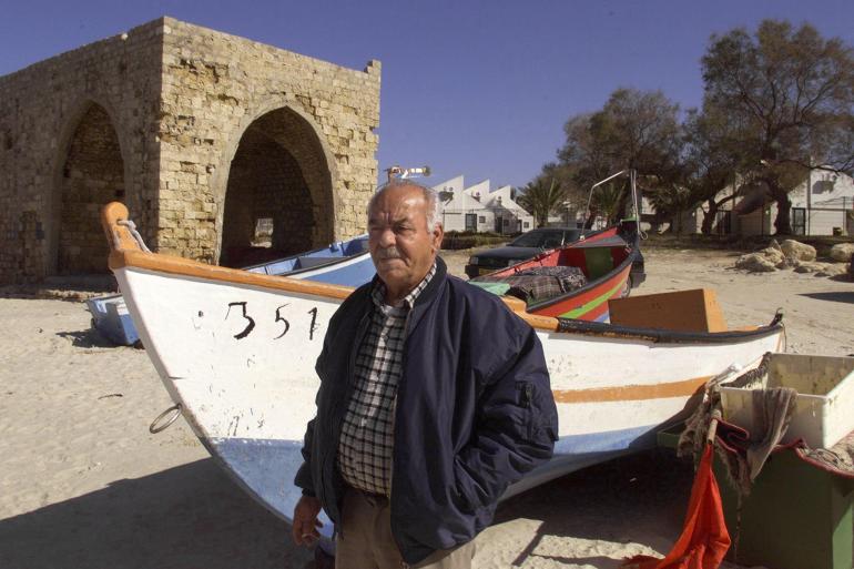 A Palestinian man poses on the site of Tantura, a Palestinian coastal village that was ethnically cleansed in 1948