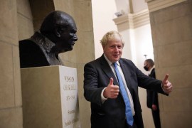 British Prime Minister Boris Johnson stops to look at a bust of Winston Churchill as he departs the U.S. Capitol following a visit with Congressional leadership on